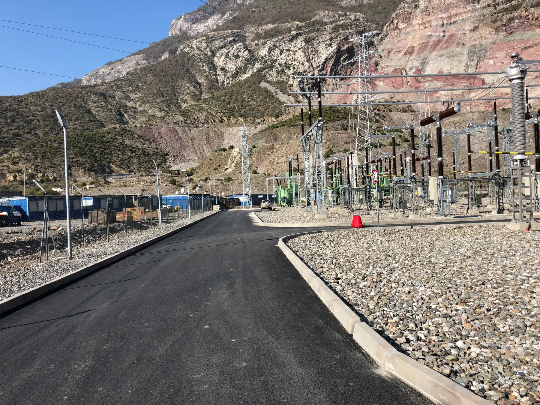 Completed high-voltage substation in a mountain setting
